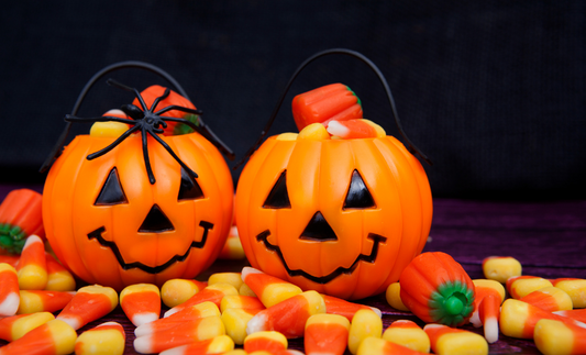 Halloween pumpkins filled with candy corn