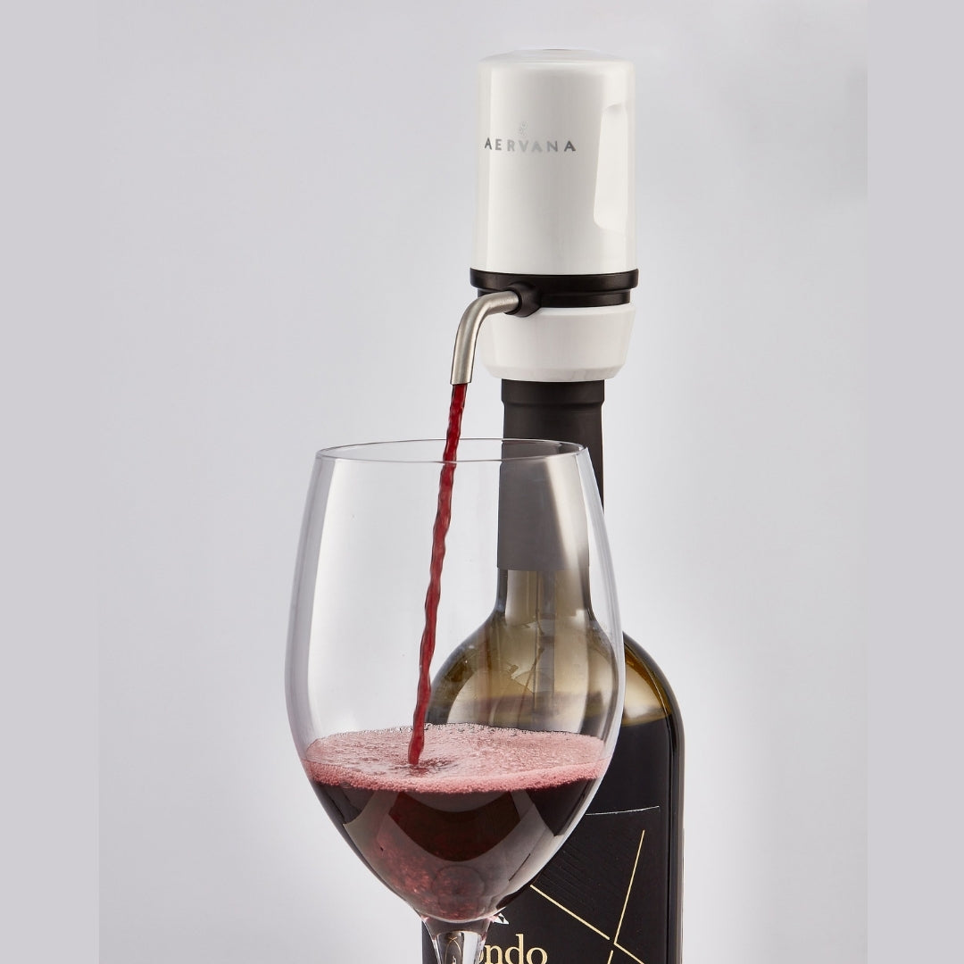 White Aervana Travel wine aerator aerating red wine into wine glass